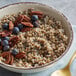 A bowl of Furmano's fully cooked sorghum with blueberries and pecans.