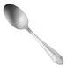 An Oneida New York stainless steel serving spoon with a design on the handle.