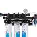 A Hoshizaki triple cartridge water filtration system with a gauge.