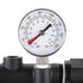 A close-up of the pressure gauge on a Hoshizaki water filtration system.