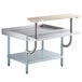 A Regency stainless steel equipment stand with a wooden top and a shelf.