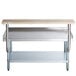 A Regency stainless steel equipment stand with a galvanized shelf and wood cutting board.