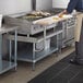 Regency 30" x 48" 16-Gauge Stainless Steel Equipment Stand with Galvanized Undershelf and 10" Wooden Adjustable Cutting Board Main Thumbnail 1