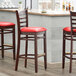 Lancaster Table & Seating Mahogany Ladder Back Bar Height Chair with Red Padded Seat Main Thumbnail 1