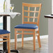 Lancaster Table & Seating Natural Wooden Window Back Chair with 2 1/2" Navy Padded Seat Main Thumbnail 1