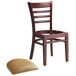 A Lancaster Table & Seating mahogany wood restaurant chair with a missing brown vinyl seat.