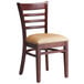 A Lancaster Table & Seating mahogany wood ladder back chair with a light brown vinyl seat.