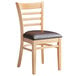 A Lancaster Table & Seating wood ladder back chair with dark brown vinyl seat.