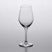An empty Lucaris Riesling wine glass on a white surface.