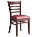 A Lancaster Table & Seating mahogany wood chair with a burgundy vinyl seat.