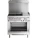 A stainless steel Cooking Performance Group range with two burners, a griddle, and an open oven door.