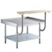A Regency stainless steel equipment stand with a galvanized undershelf and wooden top.