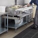 Regency 30" x 48" 16-Gauge Stainless Steel Equipment Stand with Galvanized Undershelf, 10" Plate Shelf, and 10" Stainless Steel Adjustable Work Surface Main Thumbnail 1