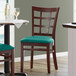 Lancaster Table & Seating Mahogany Wooden Window Back Chair with 2 1/2" Green Padded Seat Main Thumbnail 1