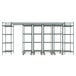 A grey metal Metro Top-Track shelving unit with wheels and shelves.