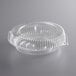 A Choice clear plastic pie container with a low dome lid.