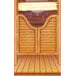 The wood surface of a Southwest themed saloon door with a mirror and bottles on it.