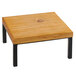 A Cal-Mil Madera rustic wood square riser on a wooden table with black legs.