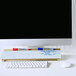 A Quartet marble frameless glass dry erase board on a black computer screen with a white border.