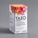 A white Tazo tea box with orange and pink flowers.