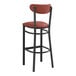 A Lancaster Table & Seating black bar stool with burgundy cushion and back.