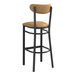 A Lancaster Table & Seating black bar stool with light brown vinyl seat and backrest.