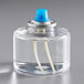 A clear Leola Candle liquid fuel cartridge with a blue and white cap.
