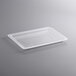 A clear plastic Vigor food storage box lid on a gray surface.