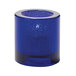 A Hollowick round cobalt glass tealight candle holder with a round base.