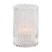 A clear glass Hollowick cylinder candle holder.