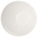 A white slanted melamine bowl with a circle on it.
