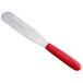 A Dexter-Russell baking and icing spatula with a large metal blade and red plastic handle.