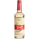 A Torani Puremade French Vanilla flavoring syrup 750 mL glass bottle with a red label.