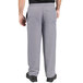 A person wearing Uncommon Chef houndstooth chef pants.