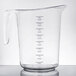 A Choice clear plastic measuring cup with black graduations and a handle.