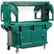 A green Cambro food cart with clear top.