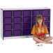 A young girl sitting in front of a Rainbow Accents purple storage cabinet with purple and white bins.