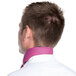 The back of a man wearing a mauve chef neckerchief.