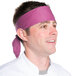 A chef wearing a mauve Intedge bandana on his head.