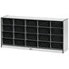 A white storage cabinet with black cubbies on a white background.