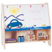 A Jonti-Craft children's wood twin activity center with a white board showing a blue car drawing.