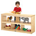 A young boy playing with toys on a Jonti-Craft open wood shelf.
