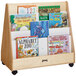 A Jonti-Craft wooden book rack with children's books on it.