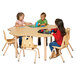 A group of children playing at a Jonti-Craft adjustable height table.