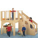 A group of kids playing on a Jonti-Craft wooden play loft with a slide.
