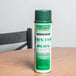 A green can of Noble Chemical Luster Plus furniture spray on a table.