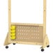 A wooden pegboard with yellow bins and hooks on a wooden stand.