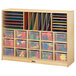 A Jonti-Craft wooden storage unit with many plastic bins and clear trays.