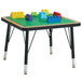 A Jonti-Craft preschool brick building table with legos on it.