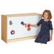 A girl playing with a Jonti-Craft mobile wood storage cabinet with magnetic whiteboard.